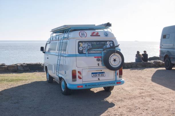 colonia del sacramento, uruguay - november 1 2022: a volkswagen van or bus parked at cost with sea or ocean view