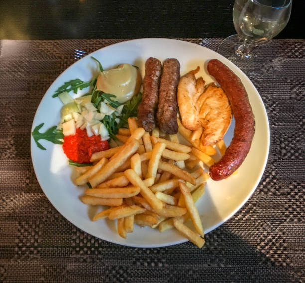 istock Dinner of assorted sausages and chicken 2152395833