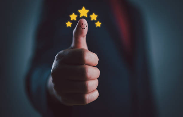 istock Customer service, and satisfaction concept. Hand with thumb up Positive emotion smile face icon and five star, review, feedback. Collect information from customers for business development. 2152396171