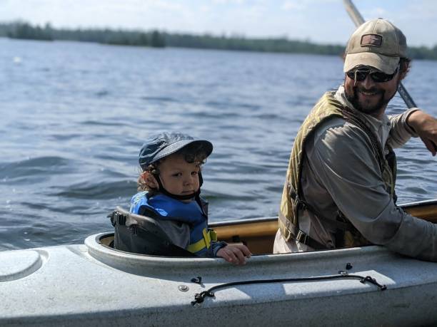 istock Father and son kayaking 2152397081