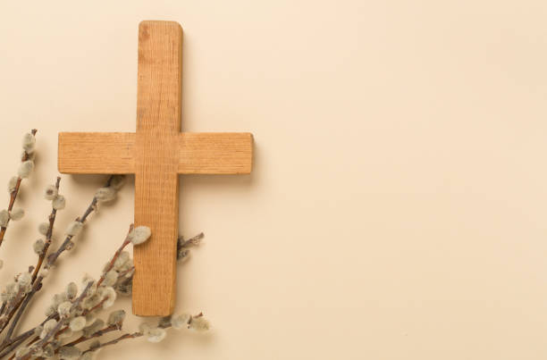 istock Cross with willow branches on color background, top, view. Palm Sunday concept 2152400684