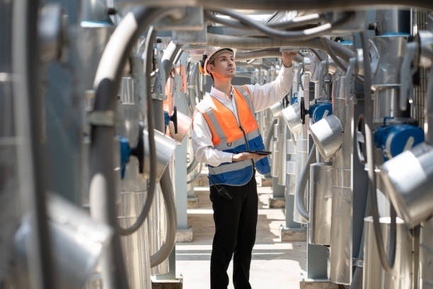 istock Engineers are inspecting a large building or industrial facility's cooling system for the air conditioning on rooftop building. 2152401129
