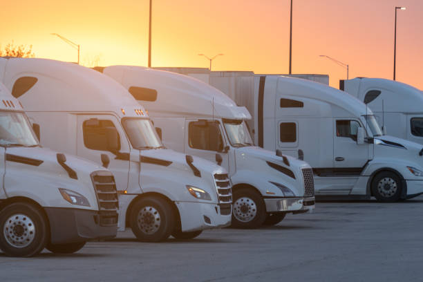 istock Rows of Trucks Parked at a Rest Stop Against a Beautiful Sunset 2152402537
