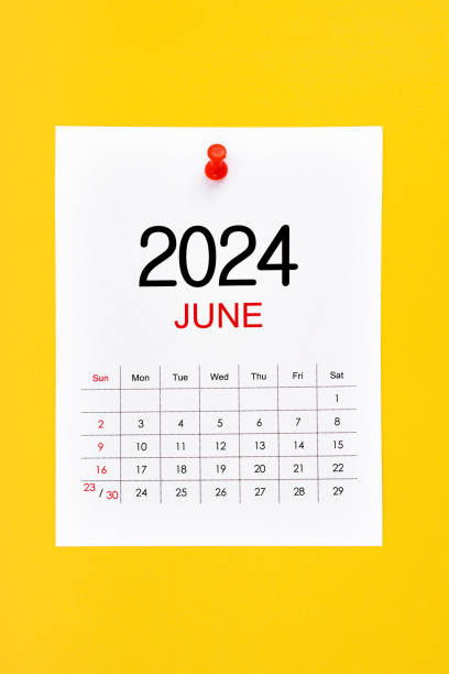 istock June 2024 calendar page with push pin on yellow background. 2152405440