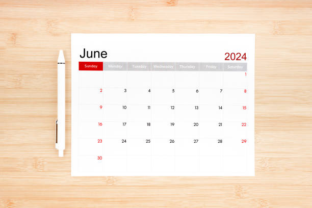 istock June 2024 calendar page on wooden. 2152405453