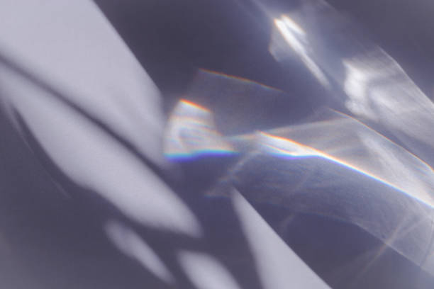 istock Sunlight background, abstract backdrop with light and shadow, glare and shine on paper texture, rainbow sun flare, blue violet color aesthetic image. Natural beams light, caustics effect 2152407674