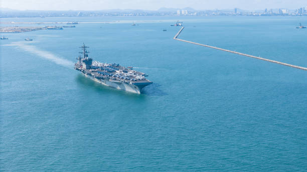 istock . Nuclear Navy ship, Military navy ship carrier full loading fighter jet aircraft for prepare troops. nuclear carrier running in the ocean 2152409053