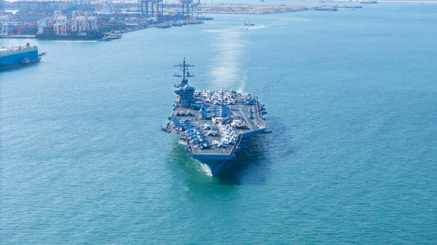 istock Nuclear Navy ship, Front of Military navy ship carrier full loading fighter jet aircraft for prepare troops. nuclear carrier running in the ocean 2152409061