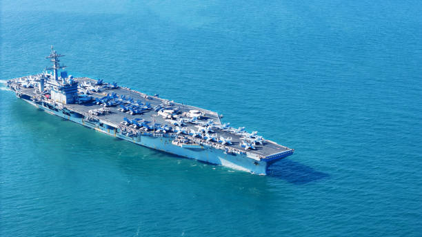 istock . Nuclear Navy ship, Military navy ship carrier full loading fighter jet aircraft for prepare troops. nuclear carrier running in the ocean 2152409066