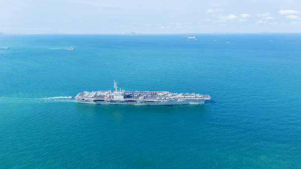 istock . Nuclear Navy ship, Military navy ship carrier full loading fighter jet aircraft for prepare troops. nuclear carrier running in the ocean 2152409067