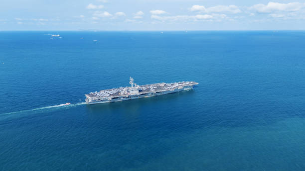 istock . Nuclear Navy ship, Military navy ship carrier full loading fighter jet aircraft for prepare troops. nuclear carrier running in the ocean 2152409070