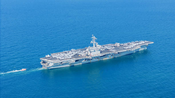 istock . Nuclear Navy ship, Military navy ship carrier full loading fighter jet aircraft for prepare troops. nuclear carrier running in the ocean 2152409078