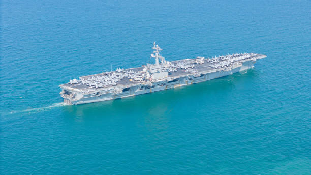 istock . Nuclear Navy ship, Military navy ship carrier full loading fighter jet aircraft for prepare troops. nuclear carrier running in the ocean 2152409079