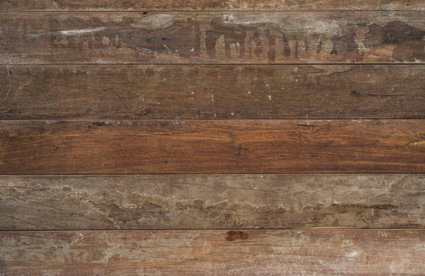 istock aged, weathered wood texture with a distressed, grunge appearance, evoking rustic charm and vintage character. Ideal for adding depth and authenticity to design projects and photographic compositions 2152416989
