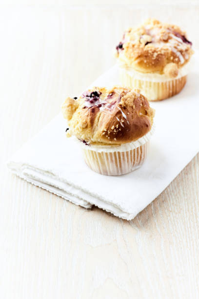 istock Muffins on bright wooden background. Close up. Copy space. 2152420535