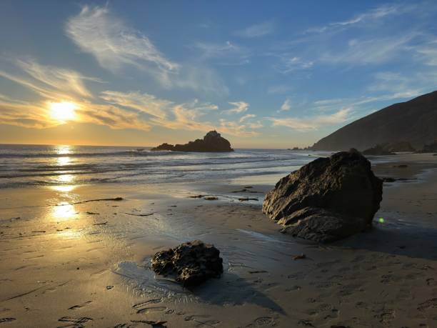 istock Sunset on the rocky beach 2152423029