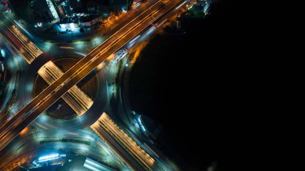 istock Expressway top view, Road traffic an important infrastructure, car traffic transportation above intersection road in city night, aerial view cityscape 2152424232