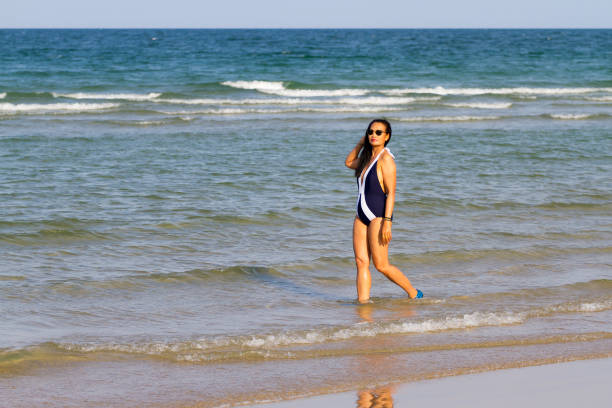 istock Woman body beautiful with bikini relax on beach 2152424490