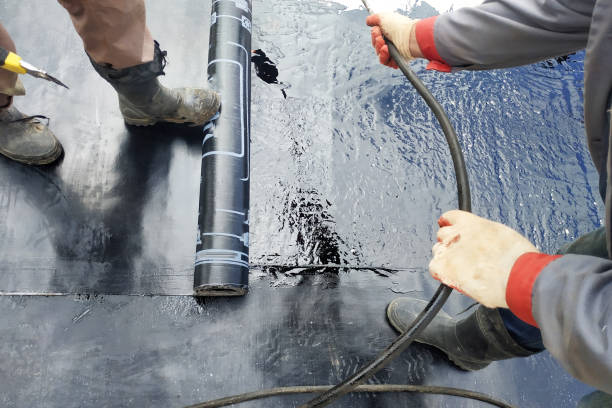 istock Professional installation of waterproofing on the concrete foundation Two worker at construction site. 2152426650