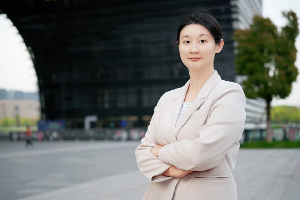 istock Confident Businesswoman Outside Modern Office Building 2152428332