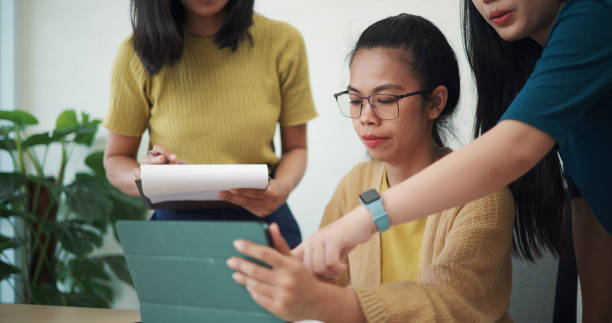 istock Females business team talking and use tablet for data analysis on project plan in modern office. 2152429367