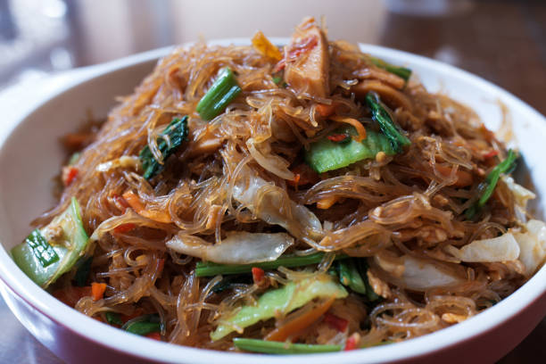 istock Stir-fried rice noodles with chicken with white cabbage 2152431116