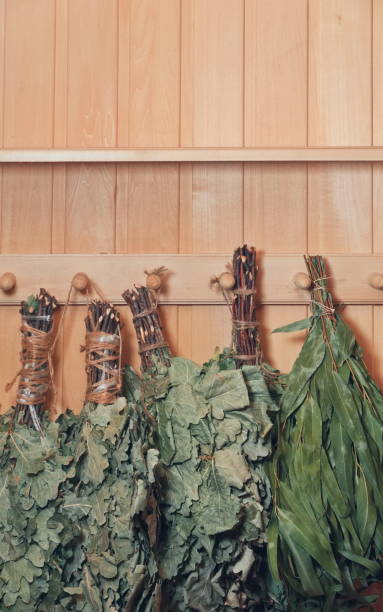istock Herbal Bunches On Wooden Wall Vertical Warm Tones 2152432276