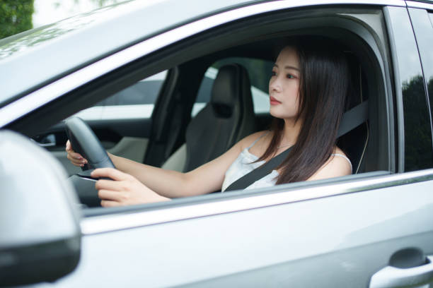 istock Asian woman driving 2152435114