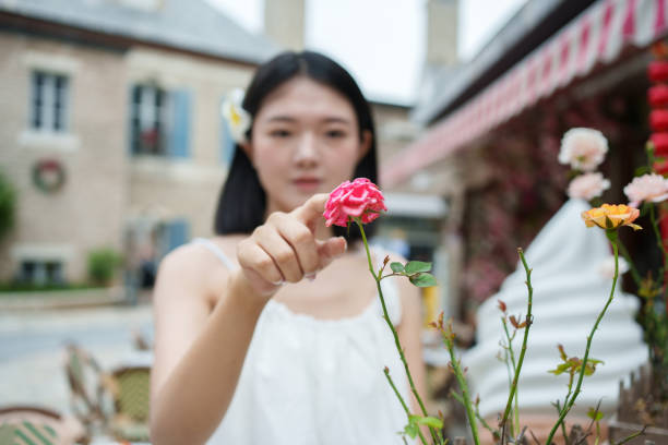 Female tourist touching flowers