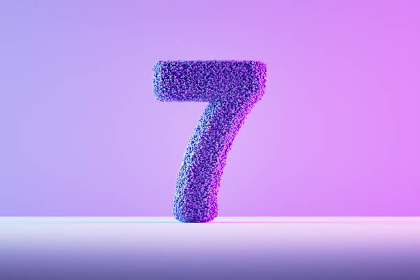 istock Number 7 with particles neon lighting purple background 2152438684