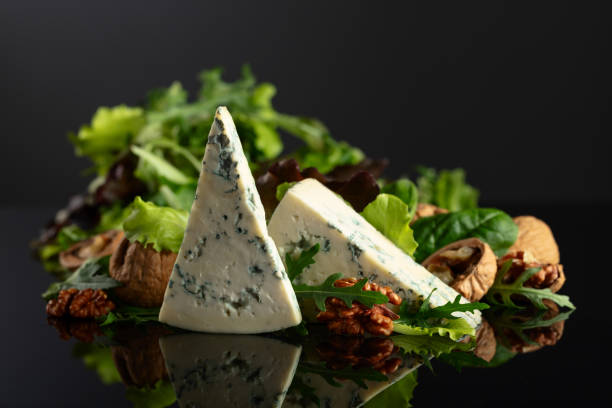 istock Blue cheese with walnuts and fresh greens. 2152438892