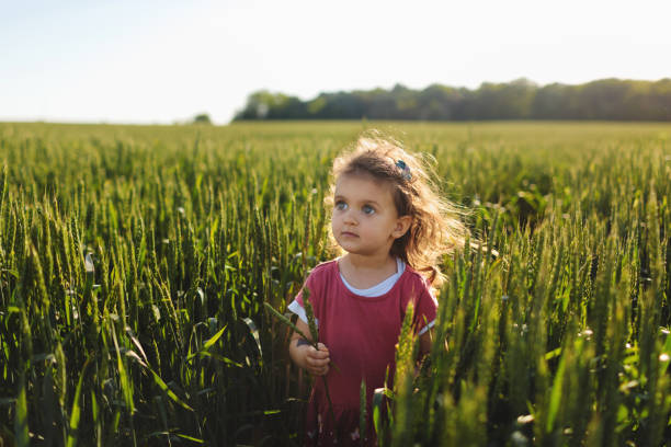 istock Young girl in wheat field. 2152439790