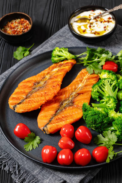 istock grilled salmon steaks with broccoli and tomatoes 2152441881
