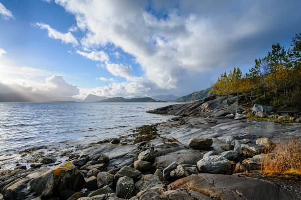 istock Majestic coastal scenery with sunlit rocks and dramatic sky at dusk 2152442186