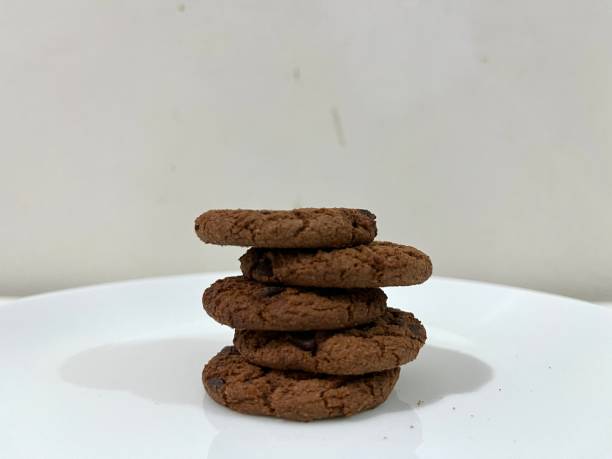 istock Chocolate cookies with chips served on a plate 2152443556