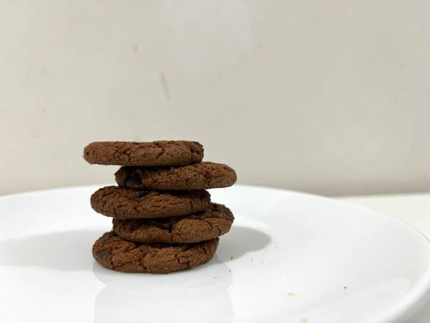 istock Chocolate cookies with chips served on a plate 2152443557