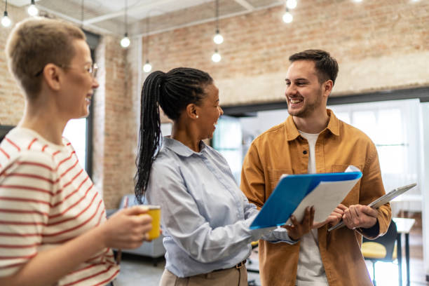 istock Young diverse colleagues having a casual business discussion 2152450509
