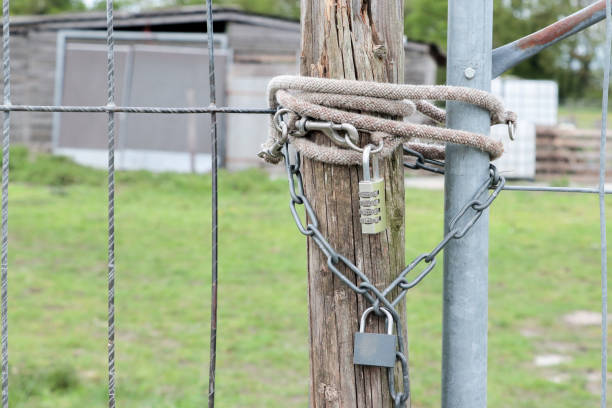 istock Padlock combination lock with chain on the fence 2152453032
