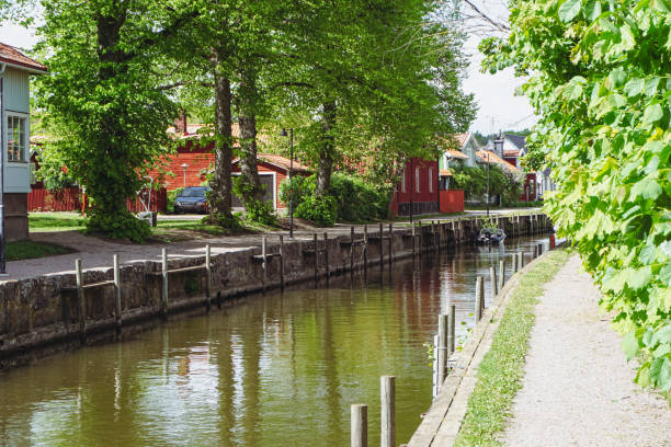 istock View of a canal through a small town 2152453124