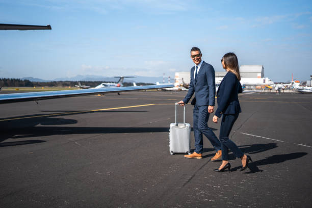 istock Asian Executives Walking Toward Private Aircraft 2152453235
