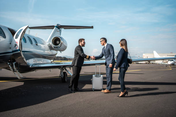 istock Asian Executives and Pilot Networking Beside Jet 2152453245