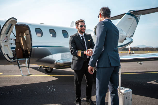 istock Pilot Handshake with Asian Business Executive at Airport 2152453246