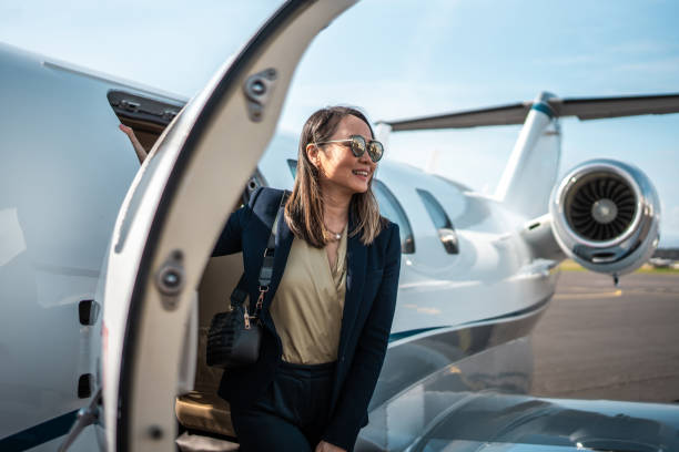 istock Successful Asian Businesswoman Exiting Private Airplane 2152453249