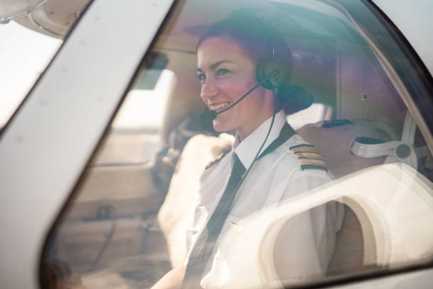 istock Confident Female Pilot Operating Aircraft Controls 2152453253