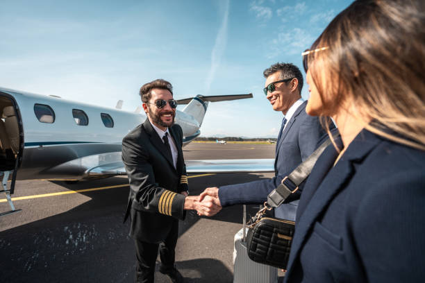 istock Asian Executives Greet Private Jet Pilot 2152453255