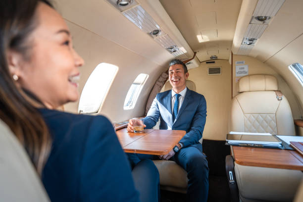 istock Mature Asian Executives During Flight Business Meeting 2152453271