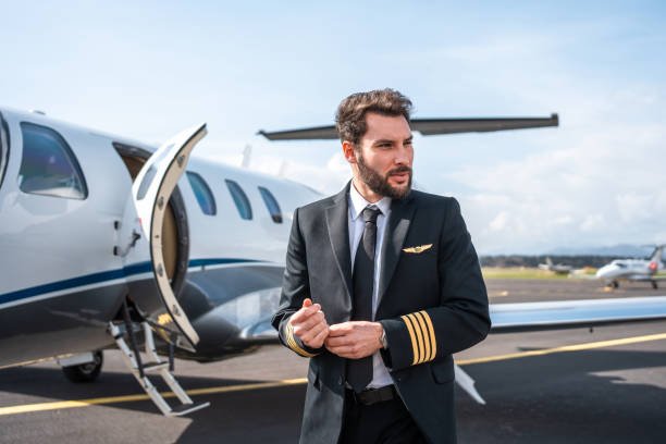 istock Confident Hispanic Pilot Beside Aircraft 2152453274