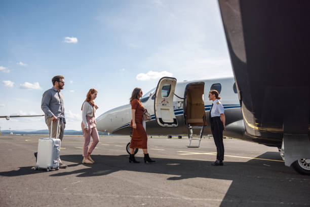 istock Family Boarding Private Jet Greeted by Pilot 2152455073