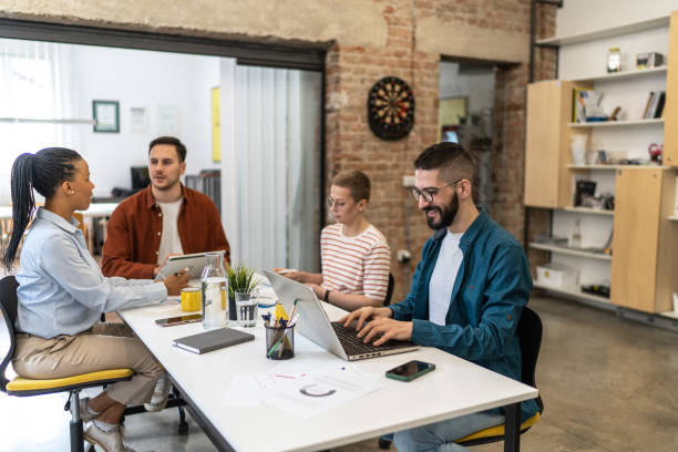 istock Young businessman working on laptop at the modern office 2152455219
