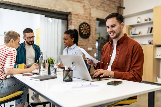 istock Young businessman working on laptop at the modern office 2152455254